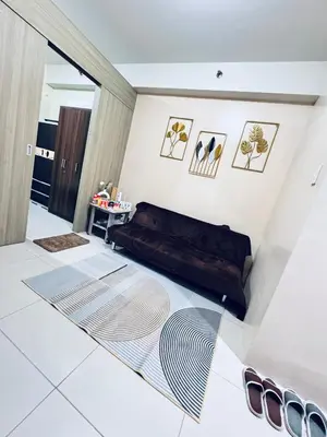 a room with a bed on a tiled floor at Smdc Breeze Residences-The Metro Breeze-Staycation in Manila