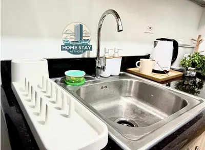 a kitchen counter with a sink in a kitchen at SHORE 2 Residences MALL OF ASIA, NAIA, PICC in Manila