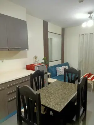 a kitchen and dining room with a table and chairs at Condotels RQ Hob in Manila