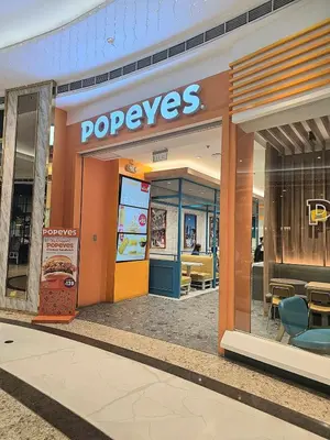 a restaurant with a sign on the front of a store at Hotel Comfort FREE Parking Fame Mall Access in Manila