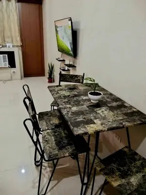 a dining room with a table and chairs at XYz's Condo - Walk To MNL T3 via Runway Manila in Manila