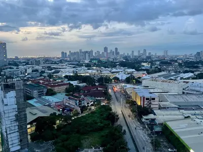 a view of a city with buildings and a street at Staycation and WFH with Netflix and Pool for up to 4 guests in Manila