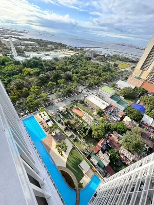 an aerial view of a city from a building at Kitty Breeze Staycation in Manila