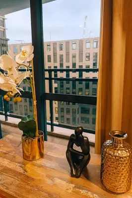 a table with a view of a city from a window at New 2BR Suite Milano Residences Poblacion Makati 110sqm in Sampong