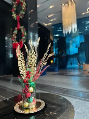 a vase with christmas decorations on top of a table at New 2BR Suite Milano Residences Poblacion Makati 110sqm in Sampong