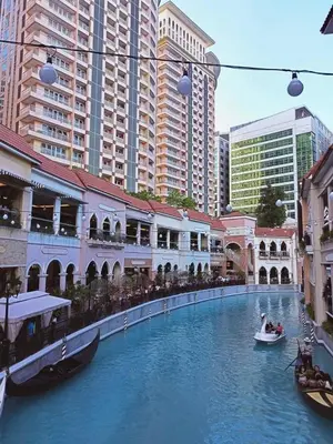 a river in a city with boats in it at Jazzy Flat in Manila