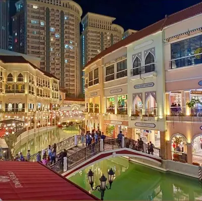 a view of a shopping mall at night at Jazzy Flat in Manila