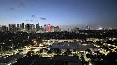 a view of a city skyline at night at City View with Balcony at Kasara Residences C5 Pasig in Manila