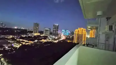 a view of a city skyline at night at City View with Balcony at Kasara Residences C5 Pasig in Manila