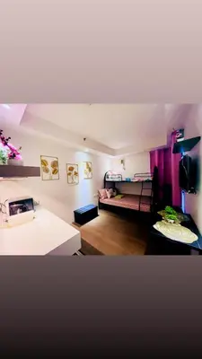 a small room with a room with a bed in it at Hotel hotel in Manila