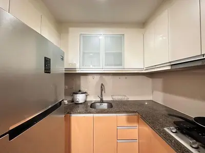 a kitchen with a sink and a counter top at 81 Newport Urban Chic Studio near NAIA Terminal 3 in Manila