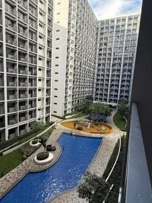 a view of a large building with a pool in the middle at S&B rentals in Manila