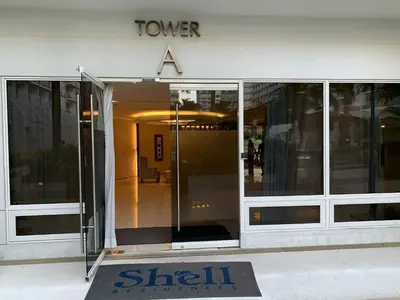 a building with a stair sign in front of a door at Shell residence Family room by Kathy in Manila