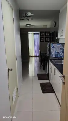 a room with a kitchen and a dining room at Moana SEA RESIDENCE condotel in Manila