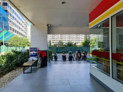 a group of motorcycles parked in a parking lot at Moana SEA RESIDENCE condotel in Manila