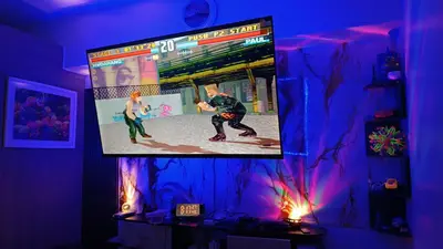 a tv screen with a man playing a video game at Shore 2 in Manila