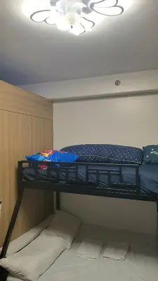 two bunk beds in a room with a ceiling at Shore 2 in Manila