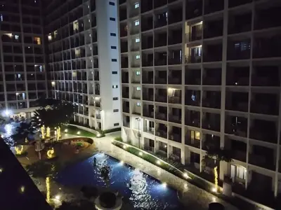 an aerial view of a building at night at Shore 2 in Manila