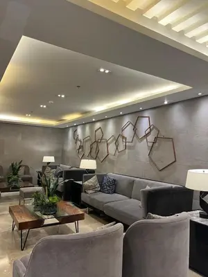 a living room with a couch and chairs at Queen Bed with Coffee Bar and Fast Wi-Fi at S Residences in Manila