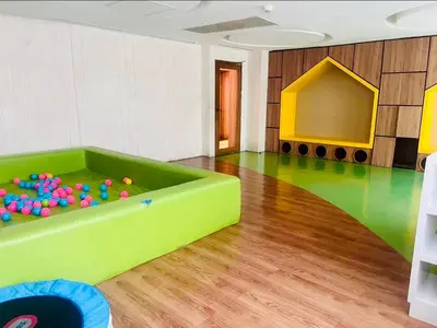 a room with a pool table in the middle of a room at Luxe 1BR BGC with Balcony in Manila