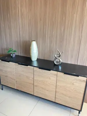 a wooden dresser with a vase and scissors on it at Venice Luxe Suite, 1 Bedroom Maximum, 4 adults plus kids in Manila
