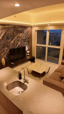 a living room with a sink and a couch at Venice Luxe Suite, 1 Bedroom Maximum, 4 adults plus kids in Manila