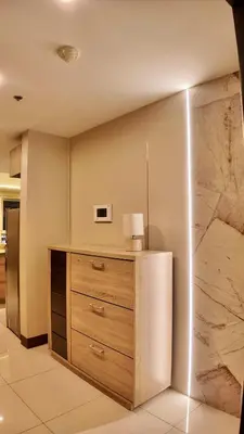 a room with a dresser with a lamp on it at Venice Luxe Suite, 1 Bedroom Maximum, 4 adults plus kids in Manila