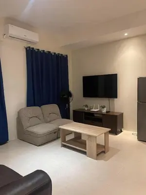a living room with a couch and a coffee table at Condotels by Tribecca Private in Manila