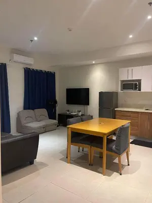 a living room with a table and a couch at Condotels by Tribecca Private in Manila