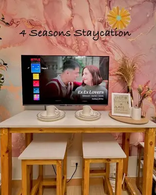 a table with a tv on top of it at Vacation Home MOLUAN in Manila
