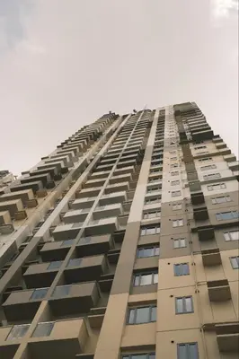 a tall building with balconies on the side of it at Manhattan Plaza Suite 1BR with City View, Netflix and Pool Access in Manila