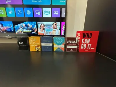 a bunch of books sitting on a shelf with a tv at Shore 2 Residences - Takya's Staycation in Manila