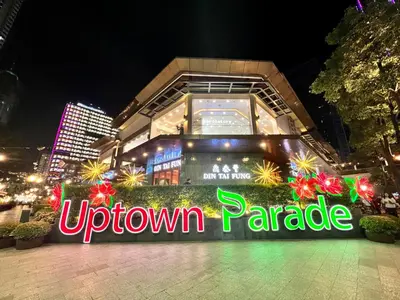 a sign that reads uptown paradise in front of a building at BGC High Rise, Uptown Mall Link, 5G WiFi, Pool, Ste 19 in Manila