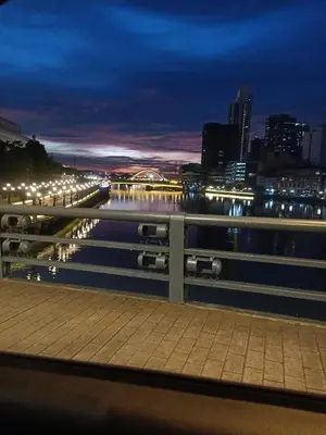 a view of a city at night from a bridge at Dream hotel in Manila