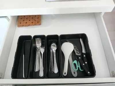 a drawer filled with utensils in a drawer at Azure Residences 1 Bedroom with Wide Balcony in Manila