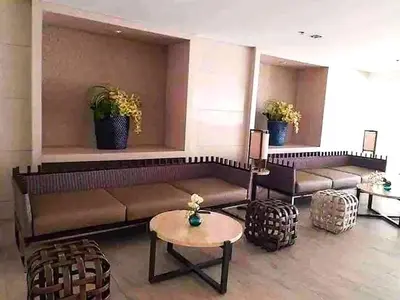 a living room with couches and a table in a room at Move In Condo in Taguig Fully Furnished in Manila