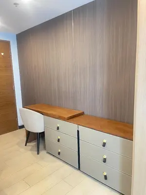 an office cubicle with a desk and a chair at La Venezia Executive Home, 3 Bedroom, 7 adults Maximum plus Kids in Manila