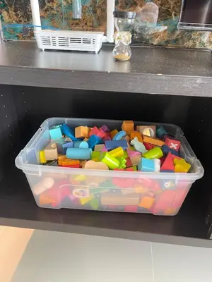 a plastic container filled with toys on a shelf at La Venezia Executive Home, 3 Bedroom, 7 adults Maximum plus Kids in Manila