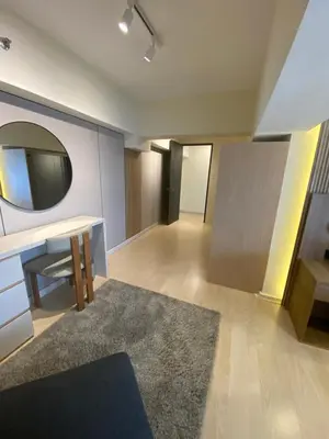 a room with a desk and a mirror on the wall at EDSA Heights Unit 3405 Cozy One Bedroom Penthouse Unit in Manila
