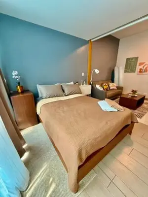 a bedroom with a large bed in a room at One Bedroom with Netflix at Uptown Residences, BGC, Taguig in Manila