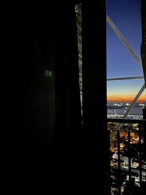 a view of a city from a window of a building at Cozy Condo with Balcony and Bay view plus PS4 at Taft Malate in Manila
