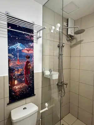 a bathroom with a painting of a woman with an umbrella at Japan Theme Near Estancia Shaw MRT Kapitolyo Shangrila Mall Megamall Elements in Manila