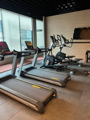a gym with several cardio machines in a room at Japan Theme Near Estancia Shaw MRT Kapitolyo Shangrila Mall Megamall Elements in Manila