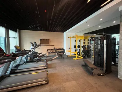 a gym with treadmills and cardio equipment in a room at Japan Theme Near Estancia Shaw MRT Kapitolyo Shangrila Mall Megamall Elements in Manila