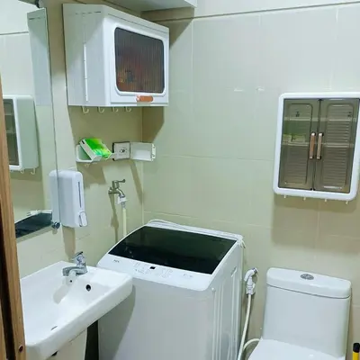 a small bathroom with a toilet and a sink at S Residences by Seren View-main in Manila