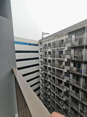 a view of an apartment building from a balcony at S Residences by Seren View-main in Manila