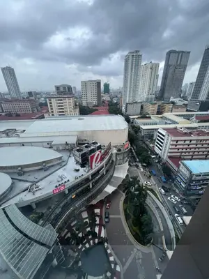 an overhead view of a city with a highway and buildings at Birch tower Condominium in Manila