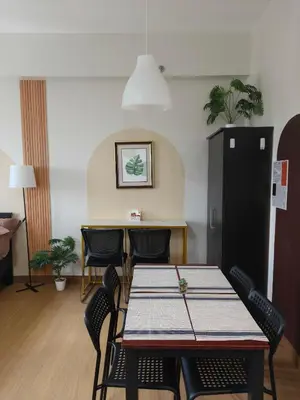 a dining room with a table and chairs at K&C Suite in Trece Martires