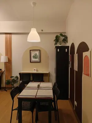 a dining room with a table and chairs at K&C Suite in Trece Martires