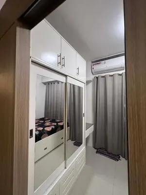 a bedroom with a bed inside of a room at Shore Residences Sm mall of asia Marc in Manila